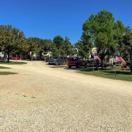 parked cars and rvs under trees